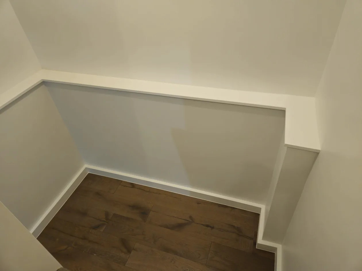 White built-in closet shelves and hanging space.